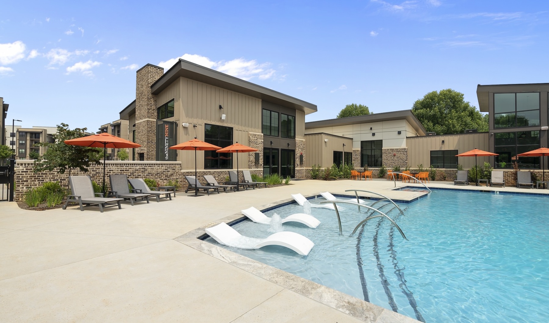 Resort style pool with sun shelf seating