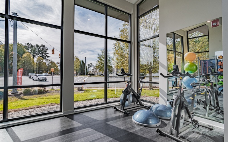 Exercise room with large windows and equipment